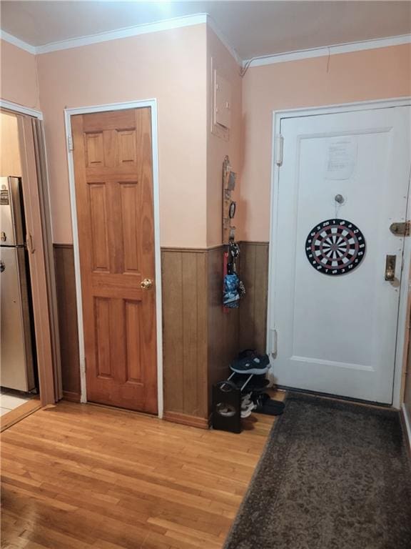 388 Avenue S Unit 2C, Brooklyn, NY 11223 - foyer featuring light wood-style flooring, ornamental molding, and wainscoting