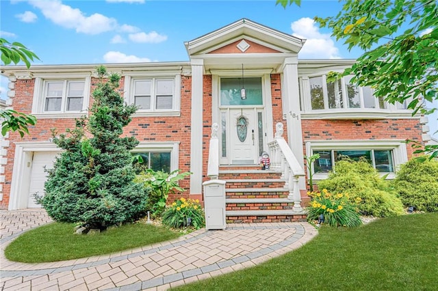 161 Ravenhurst Ave, Staten Island, NY 10310 - view of front facade with brick siding and a front yard