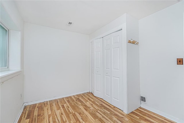 161 Ravenhurst Ave, Staten Island, NY 10310 - unfurnished bedroom with light wood finished floors and a closet