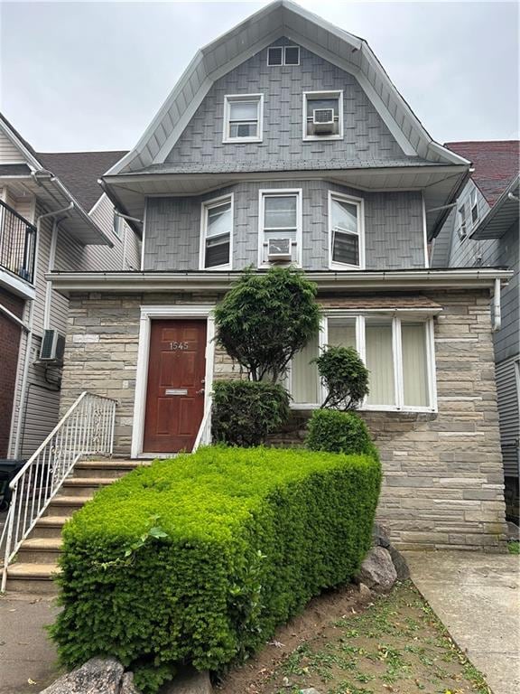 1545 E 12th St, Brooklyn, NY 11230 - view of front of property with stone siding and a gambrel roof