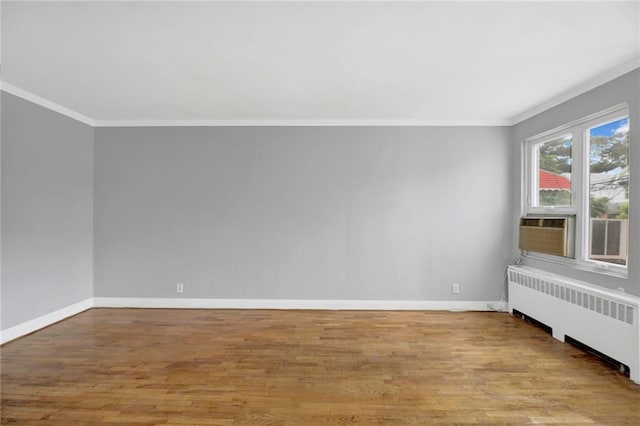 1650 E 48th St, Brooklyn, NY 11234 - spare room with radiator heating unit, ornamental molding, wood finished floors, and cooling unit