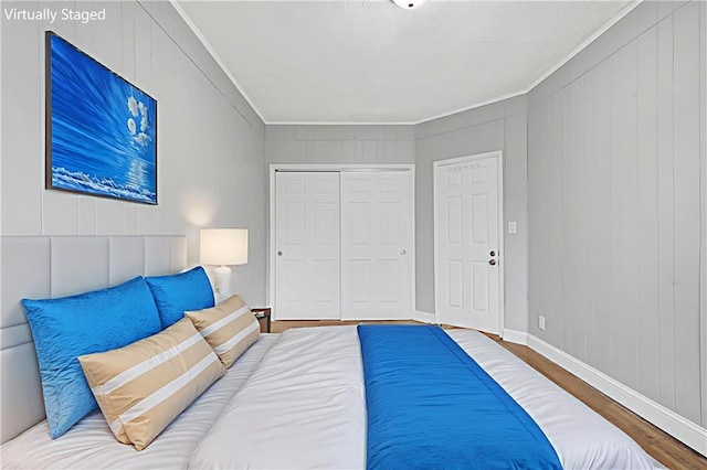 1650 E 48th St, Brooklyn, NY 11234 - bedroom featuring wood finished floors, a closet, and crown molding