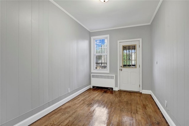 1650 E 48th St, Brooklyn, NY 11234 - entrance foyer with radiator, wood-type flooring, and ornamental molding
