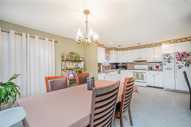 443 Ridgewood Ave, Staten Island, NY 10312 - dining room with a chandelier