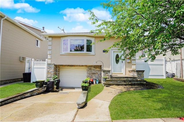 731 Stafford Ave, Staten Island, NY 10309 - view of front of house featuring stucco siding, stone siding, a garage, and driveway