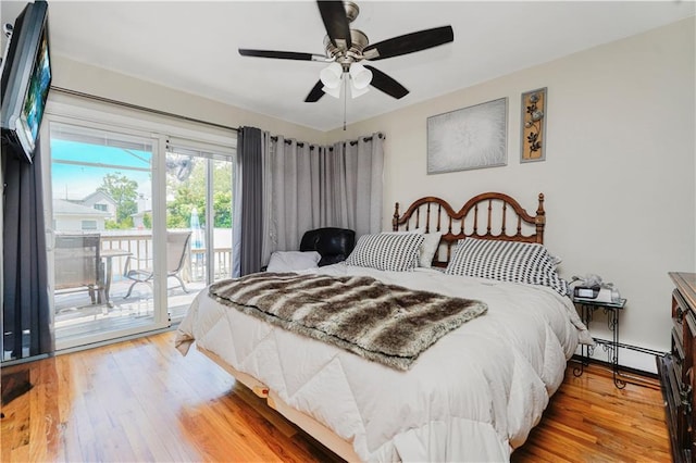 731 Stafford Ave, Staten Island, NY 10309 - bedroom with access to outside, wood finished floors, a baseboard heating unit, and ceiling fan