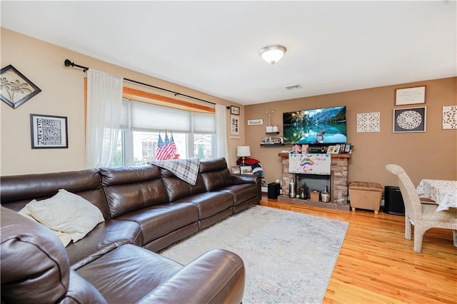 731 Stafford Ave, Staten Island, NY 10309 - living room featuring wood finished floors and a stone fireplace