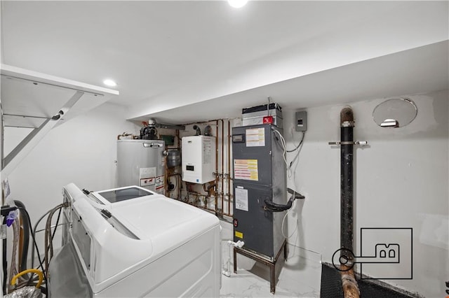 1168 E 12th St, Brooklyn, NY 11230 - utility room with washer and clothes dryer, gas water heater, tankless water heater, and heating unit