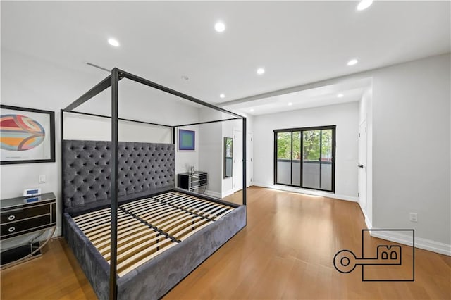 1168 E 12th St, Brooklyn, NY 11230 - bedroom with wood finished floors, access to exterior, and recessed lighting