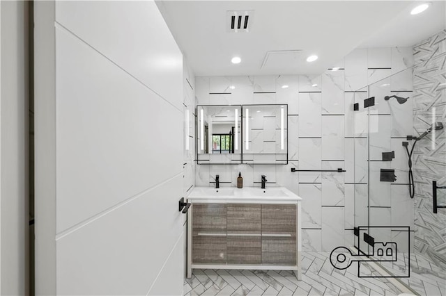 1168 E 12th St, Brooklyn, NY 11230 - full bathroom with a marble finish shower, double vanity, and recessed lighting
