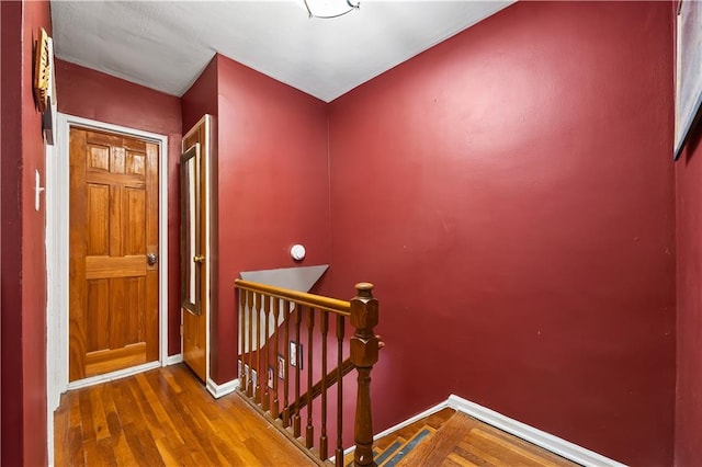 2426 Bragg St, Brooklyn, NY 11235 - hallway featuring an upstairs landing and wood finished floors