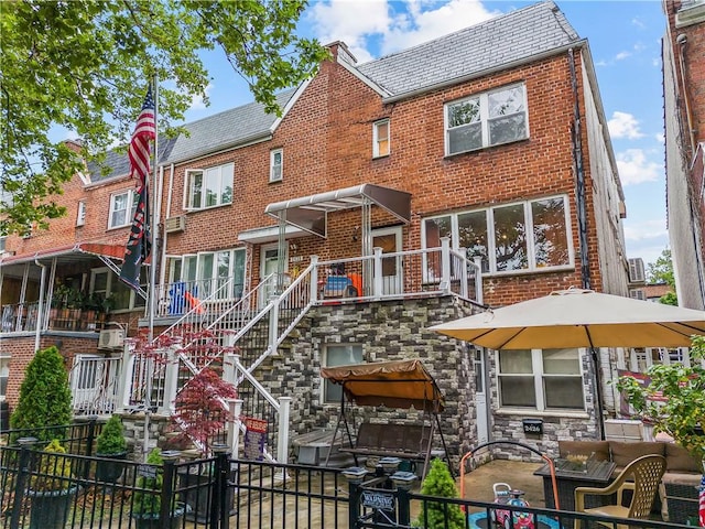 2426 Bragg St, Brooklyn, NY 11235 - view of front of property featuring brick siding and a high end roof