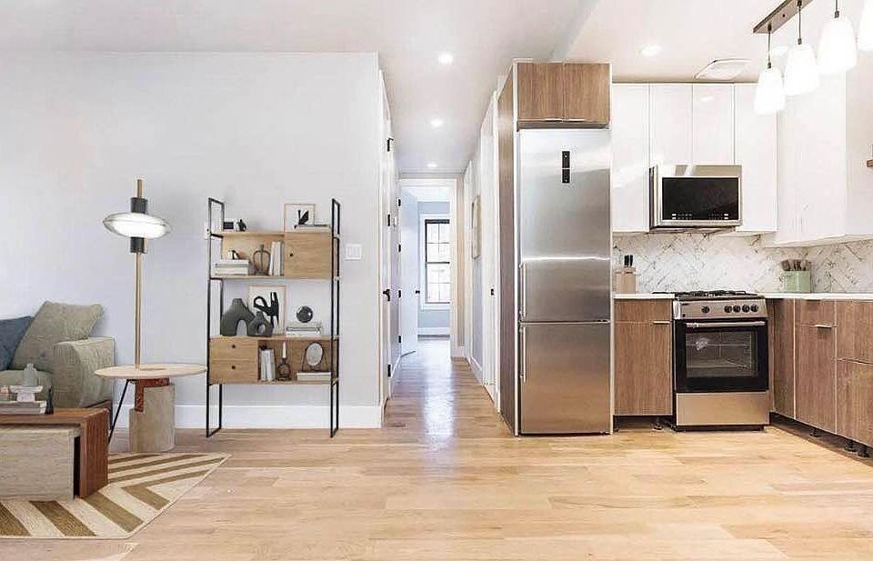 1281 Nostrand Ave, Brooklyn, NY 11226 - kitchen featuring stainless steel appliances, light wood-style flooring, brown cabinets, light countertops, and recessed lighting