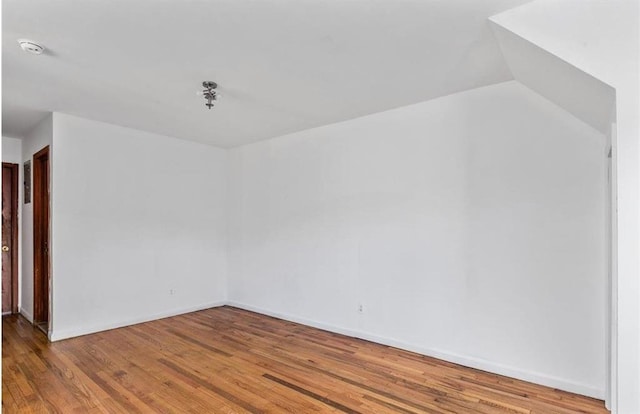 2301 W 7th St, Brooklyn, NY 11223 - unfurnished room featuring wood finished floors and a smoke detector