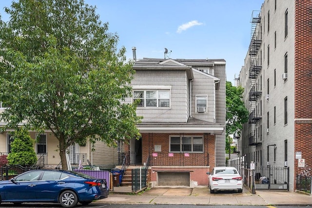 8309 19th Ave, Brooklyn, NY 11214 - multi unit property featuring brick siding, stairway, and cooling unit
