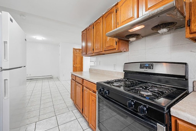 8309 19th Ave, Brooklyn, NY 11214 - kitchen featuring black gas range, white fridge with ice dispenser, under cabinet range hood, baseboard heating, and light countertops
