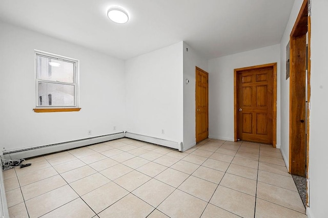 8309 19th Ave, Brooklyn, NY 11214 - unfurnished room featuring light tile patterned floors and a baseboard heating unit