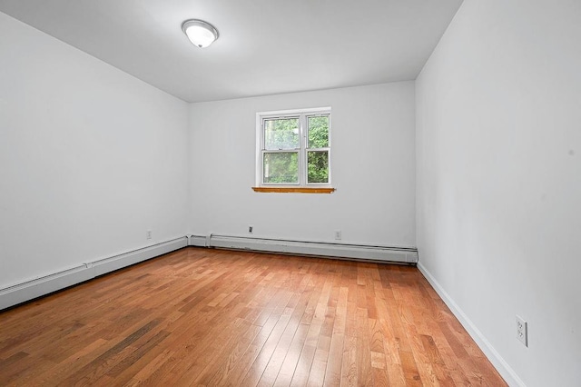 8309 19th Ave, Brooklyn, NY 11214 - unfurnished room featuring light wood-type flooring and a baseboard radiator