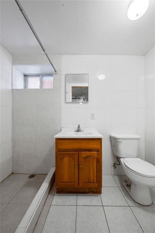 8309 19th Ave, Brooklyn, NY 11214 - full bath with tile walls, tile patterned flooring, vanity, and a tile shower
