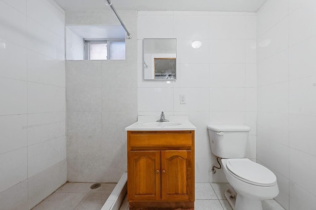 8309 19th Ave, Brooklyn, NY 11214 - full bathroom featuring tiled shower, vanity, tile patterned flooring, and tile walls