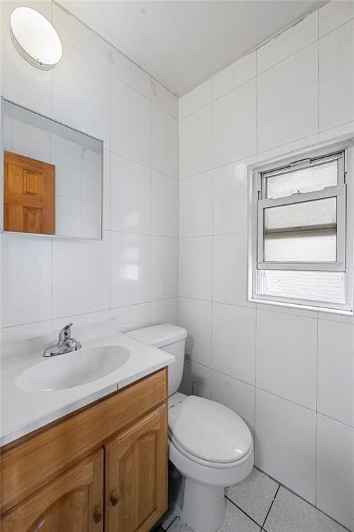 8309 19th Ave, Brooklyn, NY 11214 - half bath with vanity, tile patterned floors, and tile walls