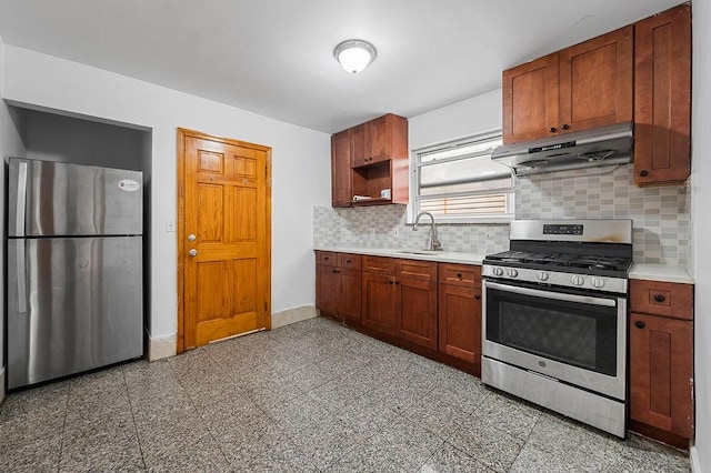 8309 19th Ave, Brooklyn, NY 11214 - kitchen featuring appliances with stainless steel finishes, under cabinet range hood, decorative backsplash, light countertops, and granite floors