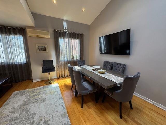 3541 Shore Pkwy Unit B2, Sheepshead Bay, NY 11235 - dining area with a wall unit AC, healthy amount of natural light, wood finished floors, and high vaulted ceiling