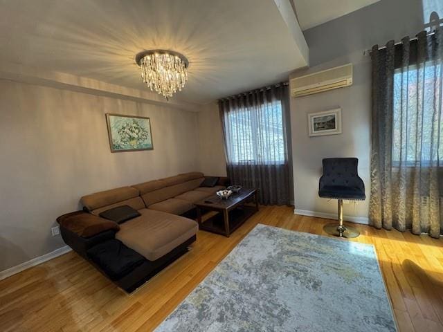 3541 Shore Pkwy Unit B2, Sheepshead Bay, NY 11235 - living room with an AC wall unit, wood finished floors, and a chandelier