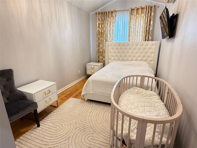 3541 Shore Pkwy Unit B2, Sheepshead Bay, NY 11235 - bedroom featuring light wood finished floors and vaulted ceiling