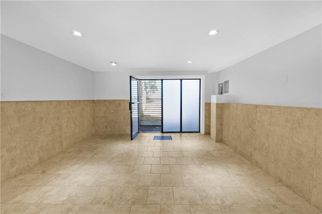 795 Father Capodanno Blvd, Staten Island, NY 10305 - unfurnished room with recessed lighting, a wainscoted wall, and tile walls
