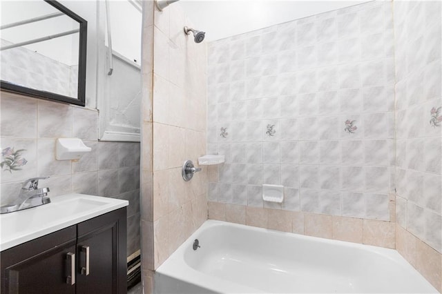 317 Pennsylvania Ave, Brooklyn, NY 11207 - full bath featuring vanity, shower / bath combination, and tile walls