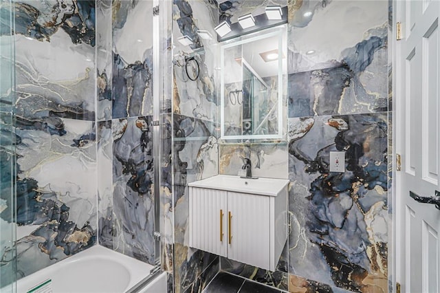 590 E 83rd St, Brooklyn, NY 11236 - bathroom featuring tile walls, vanity, and shower / tub combination