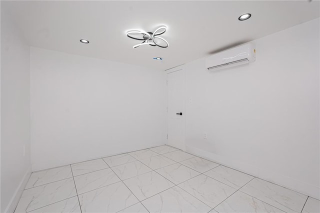 590 E 83rd St, Brooklyn, NY 11236 - unfurnished room with an AC wall unit, light marble finish floors, and recessed lighting
