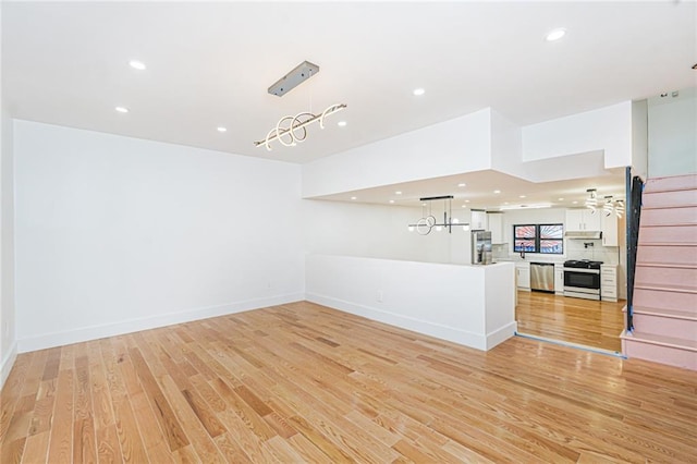 590 E 83rd St, Brooklyn, NY 11236 - unfurnished living room featuring light wood finished floors and recessed lighting