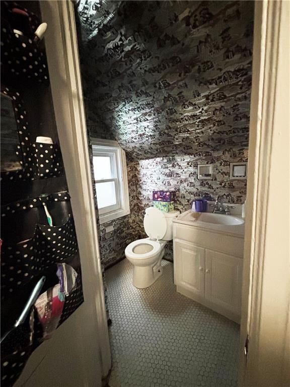 2169 E 3rd St, Brooklyn, NY 11223 - half bath featuring vanity and wallpapered walls