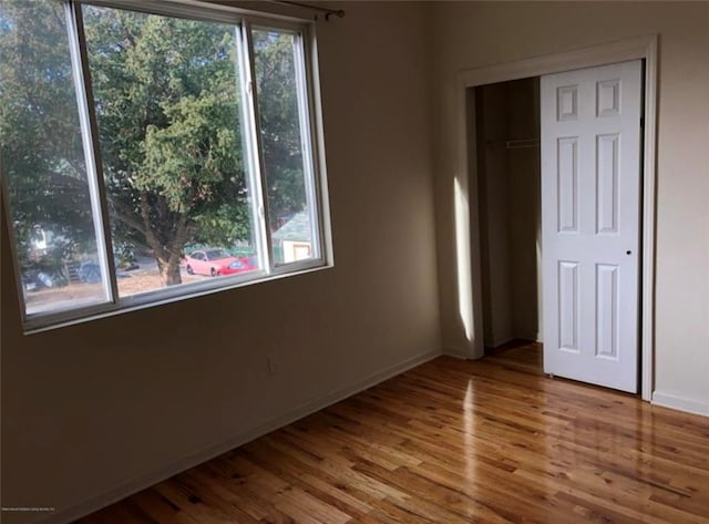 134 S Ave, Staten Island, NY 10303 - unfurnished bedroom with wood finished floors and a closet