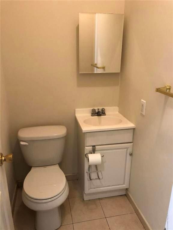 134 S Ave, Staten Island, NY 10303 - half bathroom with vanity and tile patterned flooring