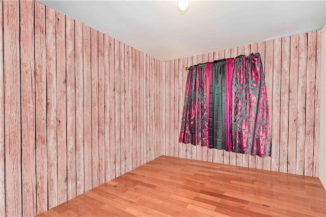 134 S Ave, Staten Island, NY 10303 - empty room with wood finished floors and wood walls