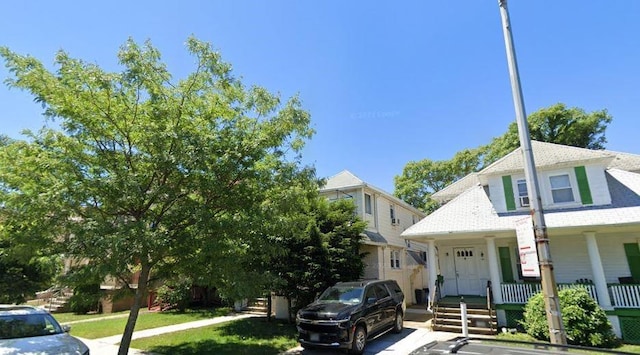 154 Beaumont St, Brooklyn, NY 11235 - view of front of house featuring a porch and roof with shingles