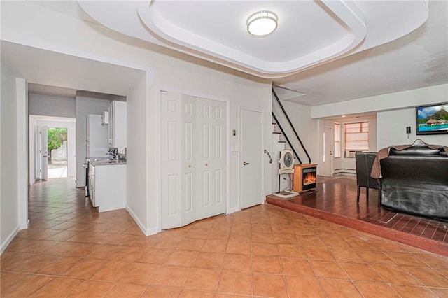 2267 W 6th St, Brooklyn, NY 11223 - entryway with light tile patterned floors, stairs, and a tray ceiling