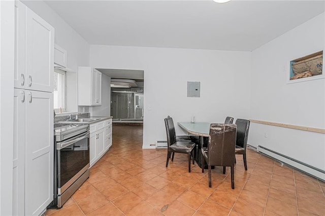 2267 W 6th St, Brooklyn, NY 11223 - dining room featuring light tile patterned floors, baseboard heating, a baseboard radiator, and electric panel