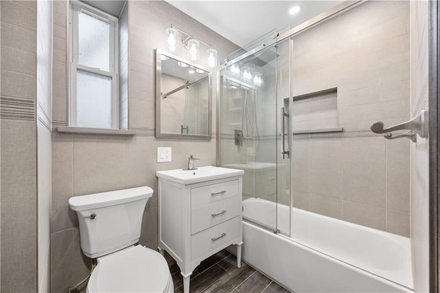 9430 Ridge Blvd Unit 4E, Brooklyn, NY 11209 - bathroom featuring enclosed tub / shower combo, vanity, and wood finished floors