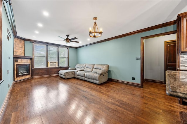 9430 Ridge Blvd Unit 4E, Brooklyn, NY 11209 - unfurnished living room with ornamental molding, a large fireplace, wood finished floors, a chandelier, and ceiling fan