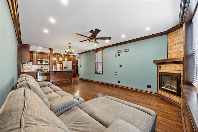 9430 Ridge Blvd Unit 4E, Brooklyn, NY 11209 - living room with ornamental molding, ceiling fan, dark wood-style flooring, a large fireplace, and recessed lighting