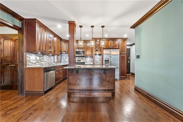 9430 Ridge Blvd Unit 4E, Brooklyn, NY 11209 - kitchen featuring appliances with stainless steel finishes, decorative backsplash, light stone counters, decorative light fixtures, and recessed lighting
