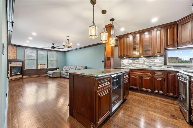 9430 Ridge Blvd Unit 4E, Brooklyn, NY 11209 - kitchen featuring wine cooler, stainless steel range oven, light stone countertops, dark wood-style flooring, and ornamental molding