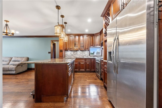 9430 Ridge Blvd Unit 4E, Brooklyn, NY 11209 - kitchen with stainless steel appliances, tasteful backsplash, glass insert cabinets, dark wood finished floors, and open floor plan