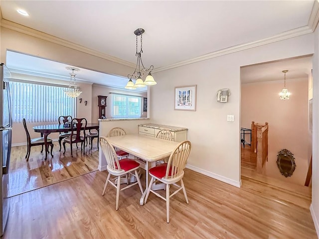 143 Getz Ave, Staten Island, NY 10312 - dining area with light wood-style floors, ornamental molding, and a chandelier