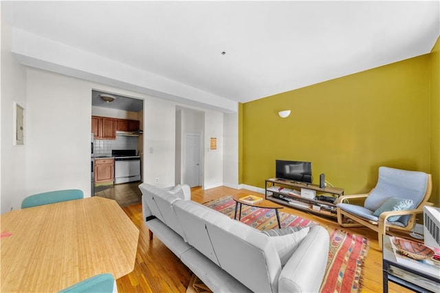 1240 Bedford Ave Unit 1H, Brooklyn, NY 11216 - living room with light wood-style flooring and baseboards
