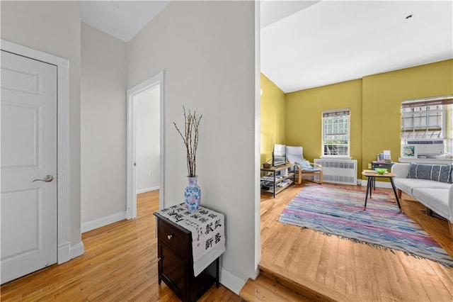 1240 Bedford Ave Unit 1H, Brooklyn, NY 11216 - sitting room with radiator, wood finished floors, and cooling unit